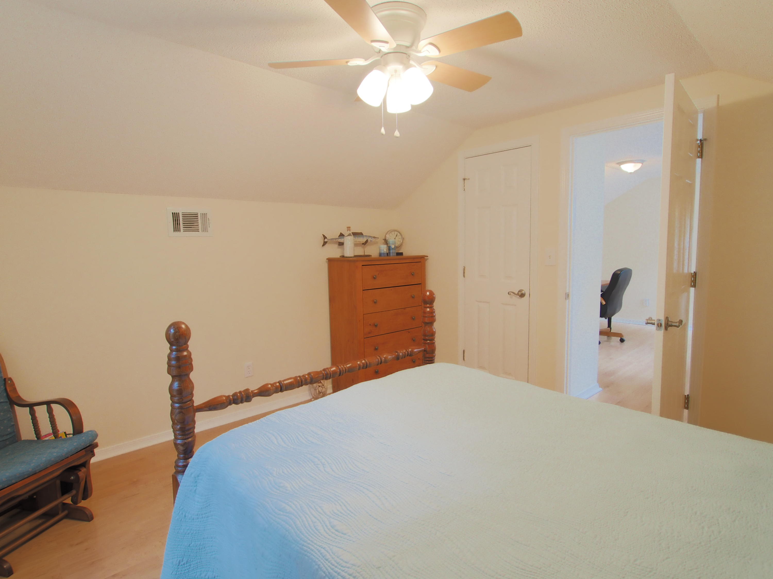 2803 Ram Lane Crestview, FL 32539 - Photo 24 of 35 a bedroom with a bed and a chandelier