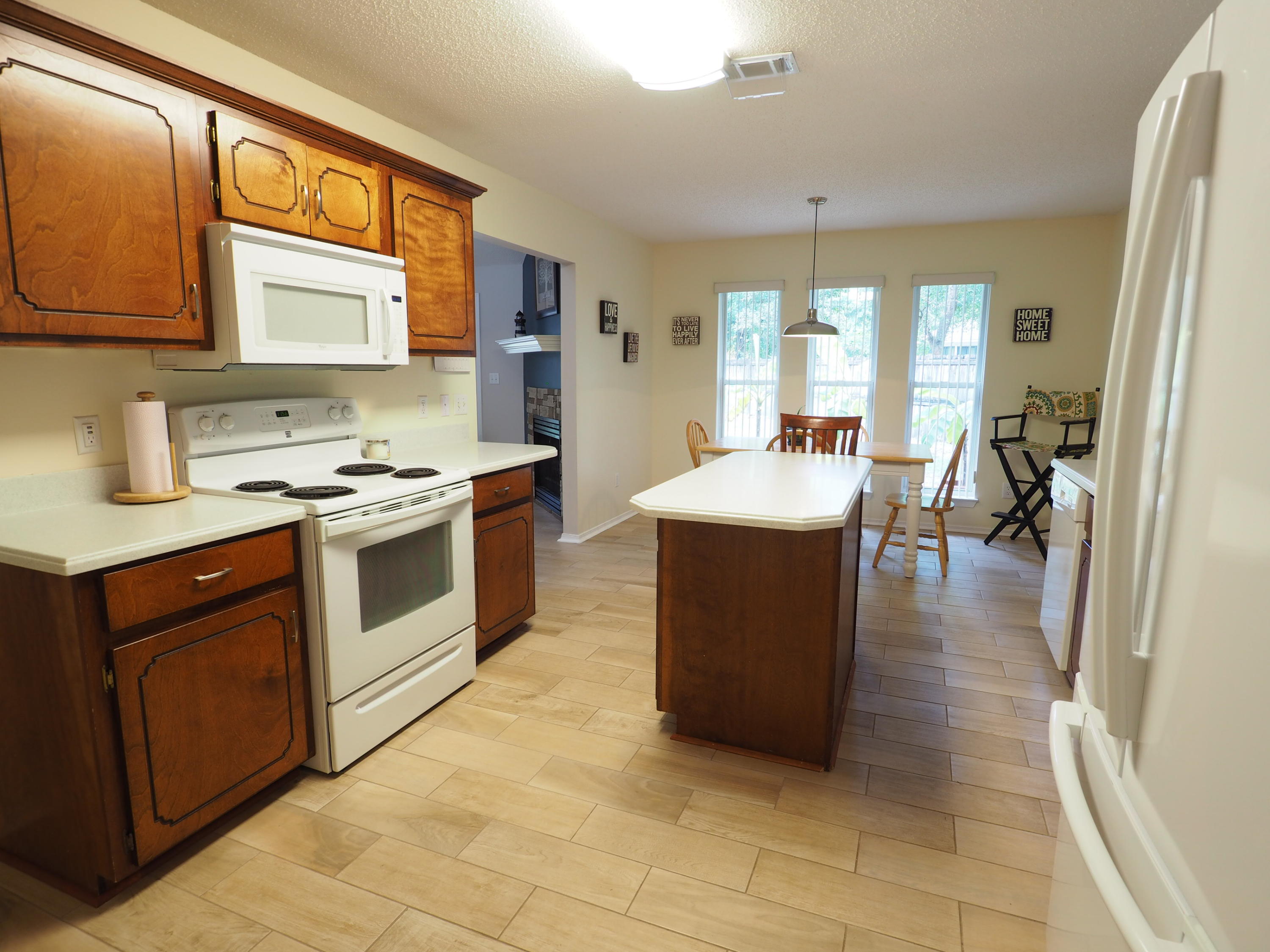 2803 Ram Lane Crestview, FL 32539 - Photo 9 of 35 a kitchen with a stove sink and cabinets