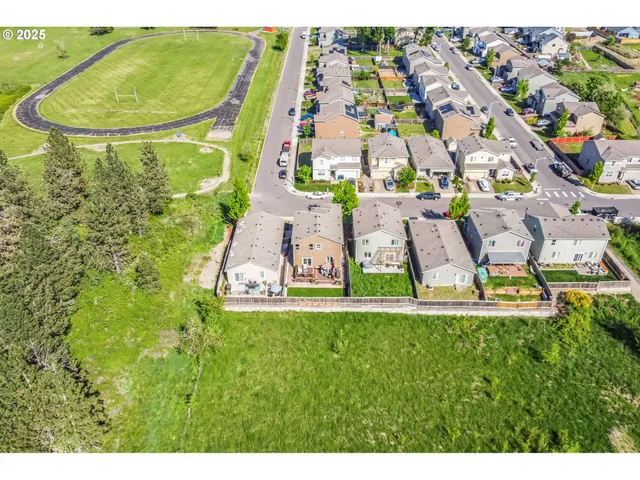 a view of a swimming pool with a yard