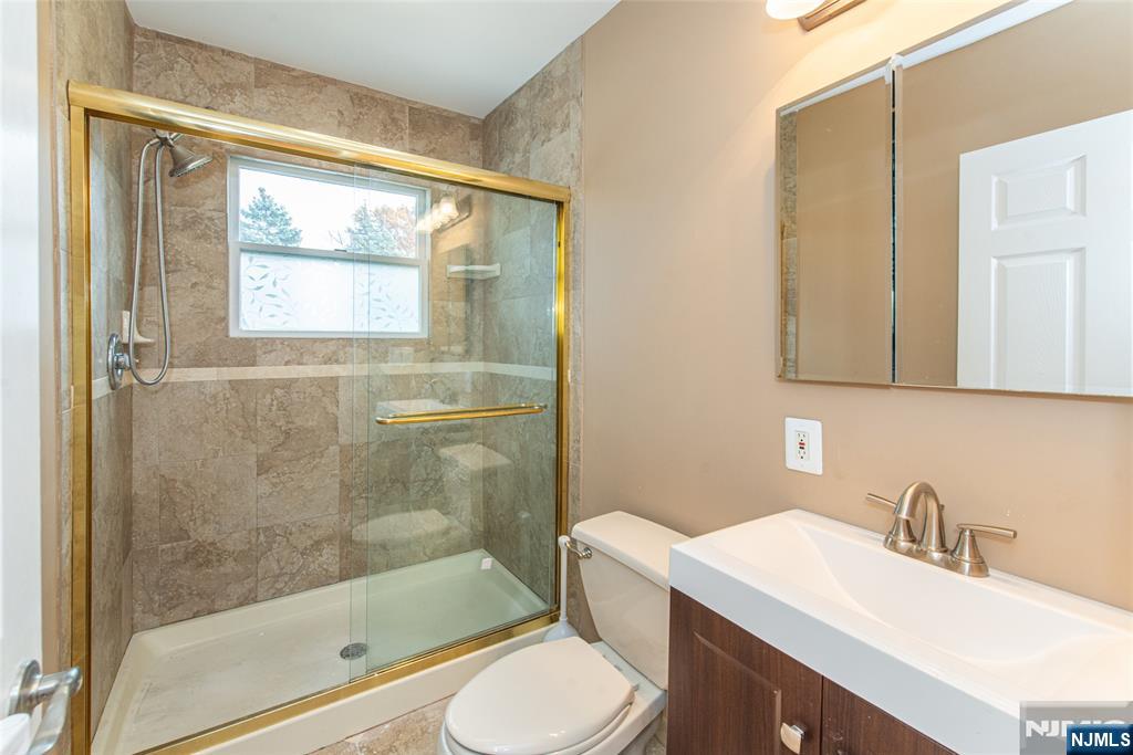 73 Grove Street Clifton, NJ 07013 - Photo 24 of 49 a bathroom with a sink toilet and shower