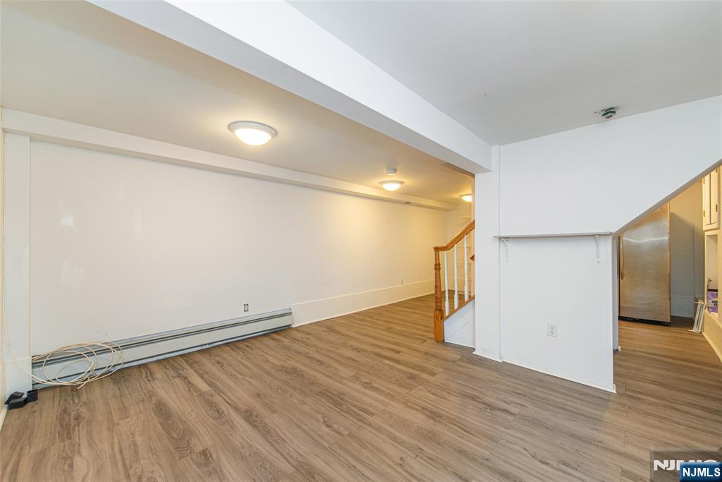 73 Grove Street Clifton, NJ 07013 - Photo 27 of 49 a view of empty room with wooden floor