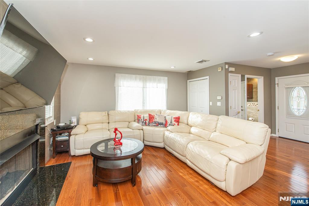 73 Grove Street Clifton, NJ 07013 - Photo 36 of 49 a living room with furniture and a table