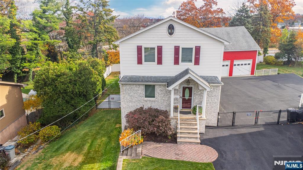 73 Grove Street Clifton, NJ 07013 - Photo 47 of 49 a front view of a house with garden