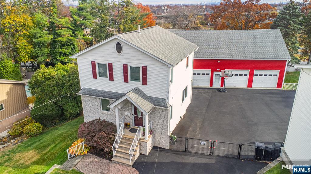 73 Grove Street Clifton, NJ 07013 - Photo 48 of 49 a view of a house with a yard plants and large tree
