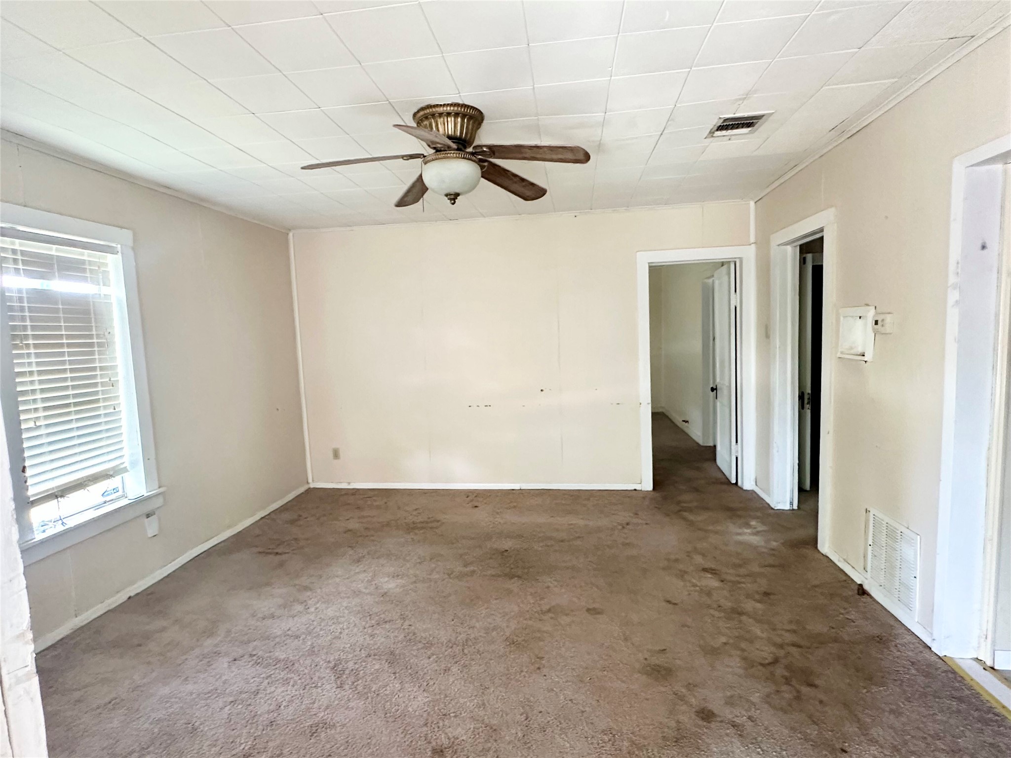 209 Old Thorndale Road Taylor, TX 76574 - Photo 6 of 14 Living room. With a few cosmetic touches, this is a great sized space with lots of potential.