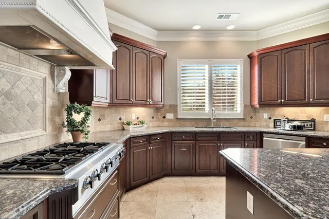 a view of a room with a table and chairs