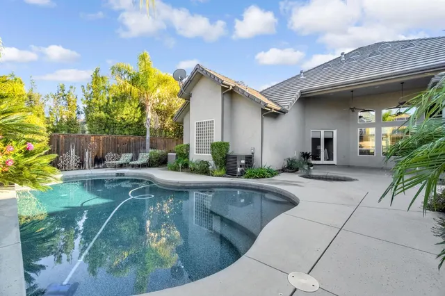 a view of a park that has a tree on the side of it