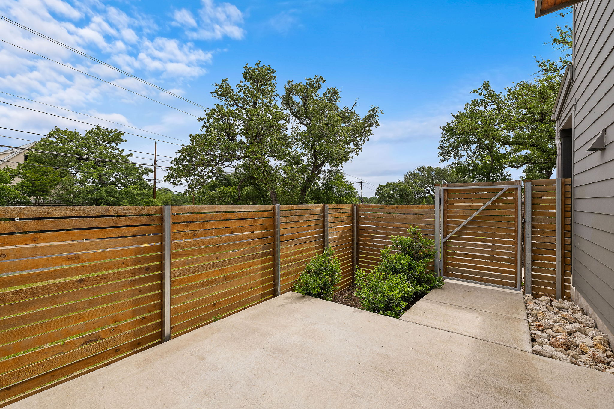 1206 Sarabeth Way Austin, TX 78721 - Photo 26 of 27 View of patio with a gate and a fenced backyard