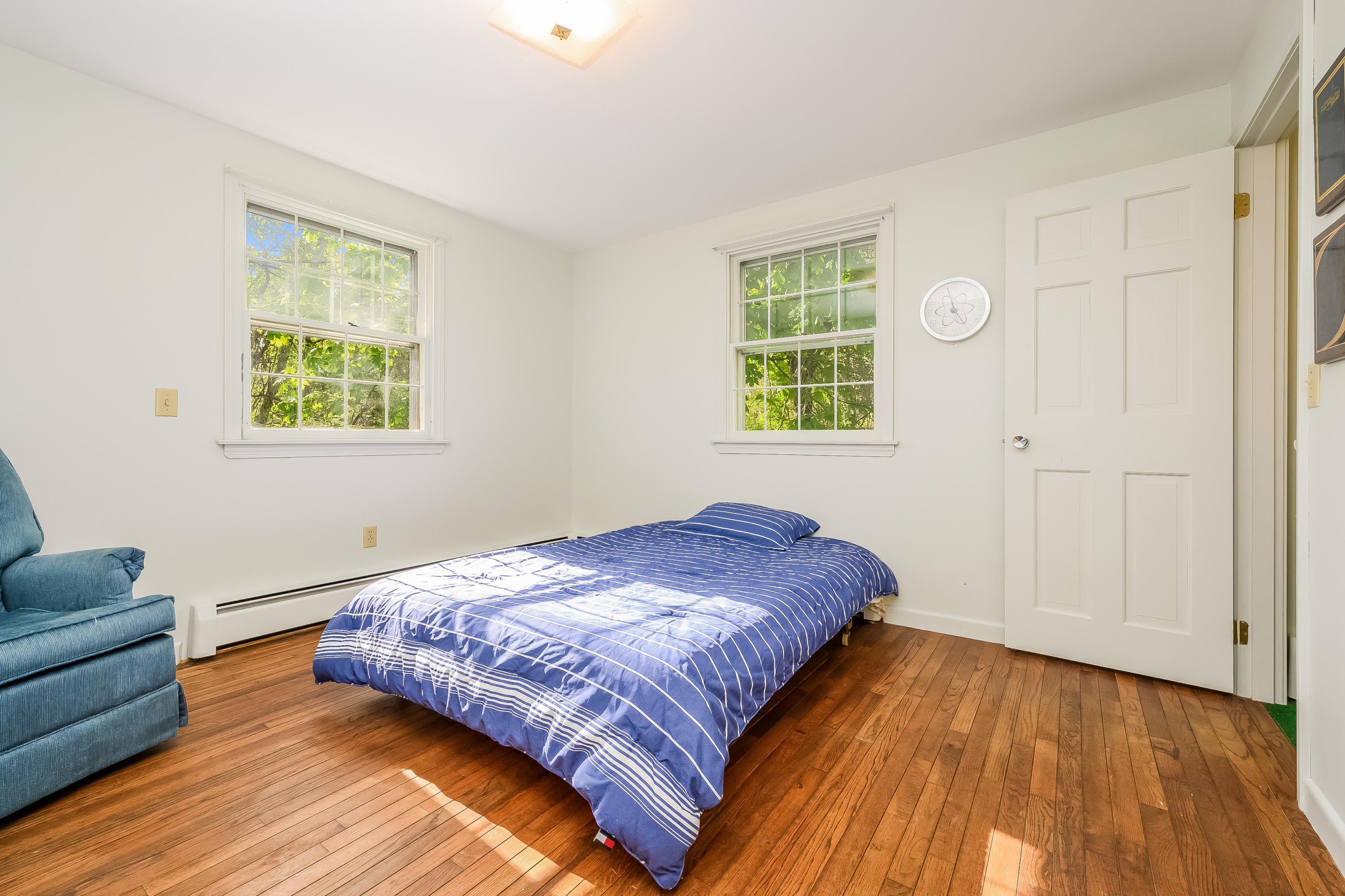 65 Chase Road Falmouth, MA 02540 - Photo 14 of 28 a bedroom with a bed and a couch