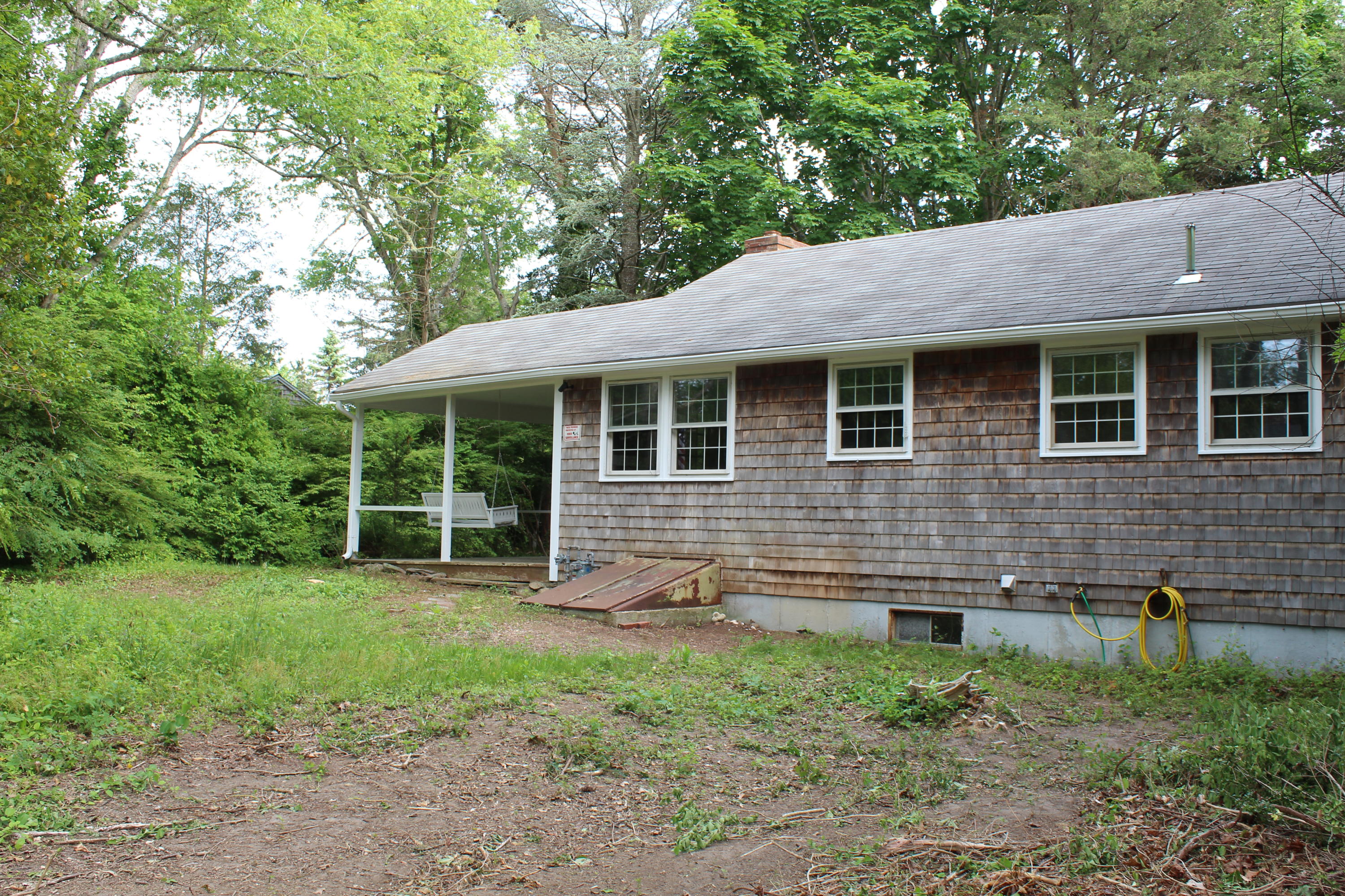 65 Chase Road Falmouth, MA 02540 - Photo 17 of 28 a front view of a house with garden