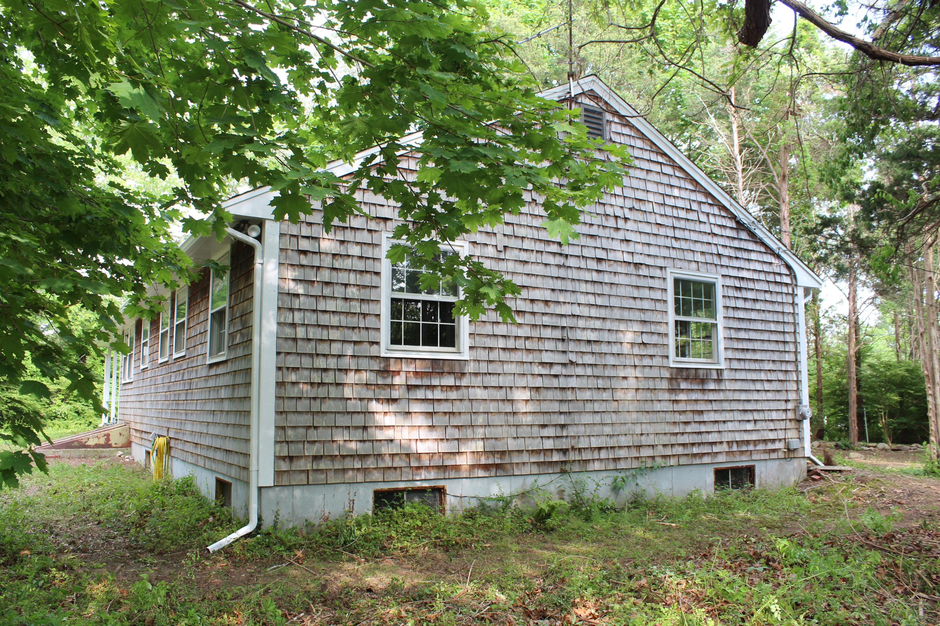 65 Chase Road Falmouth, MA 02540 - Photo 19 of 28 a view of a house with a yard