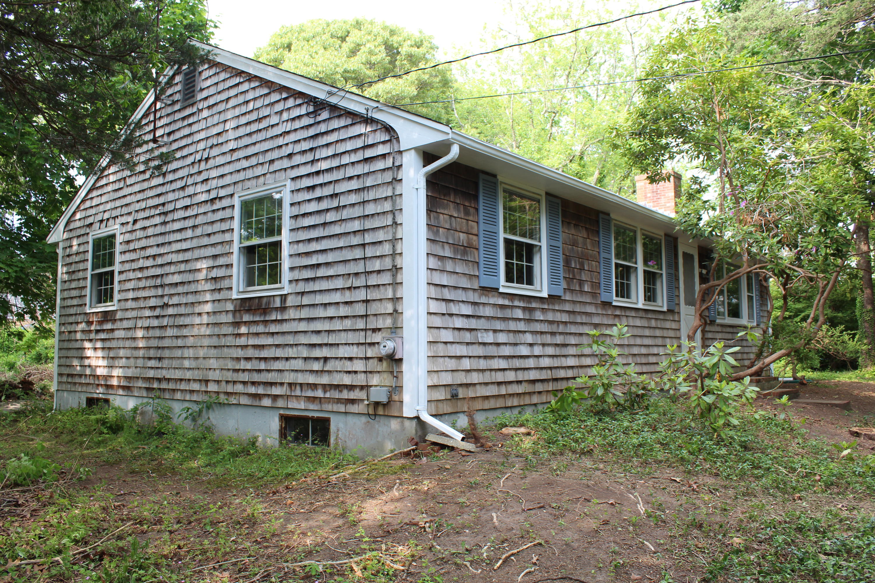 65 Chase Road Falmouth, MA 02540 - Photo 20 of 28 a view of a house with a yard
