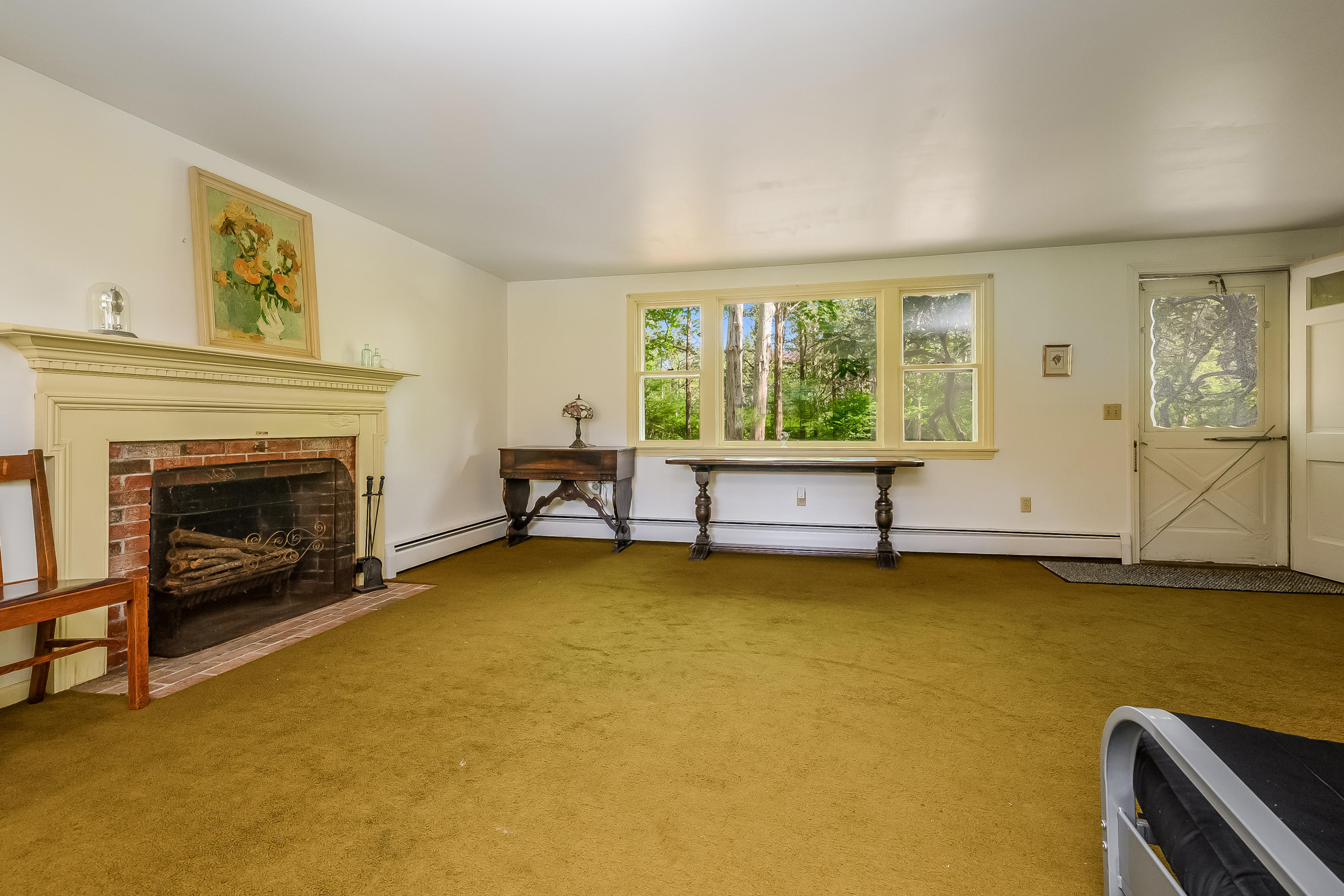 65 Chase Road Falmouth, MA 02540 - Photo 4 of 28 a living room with furniture and a fireplace