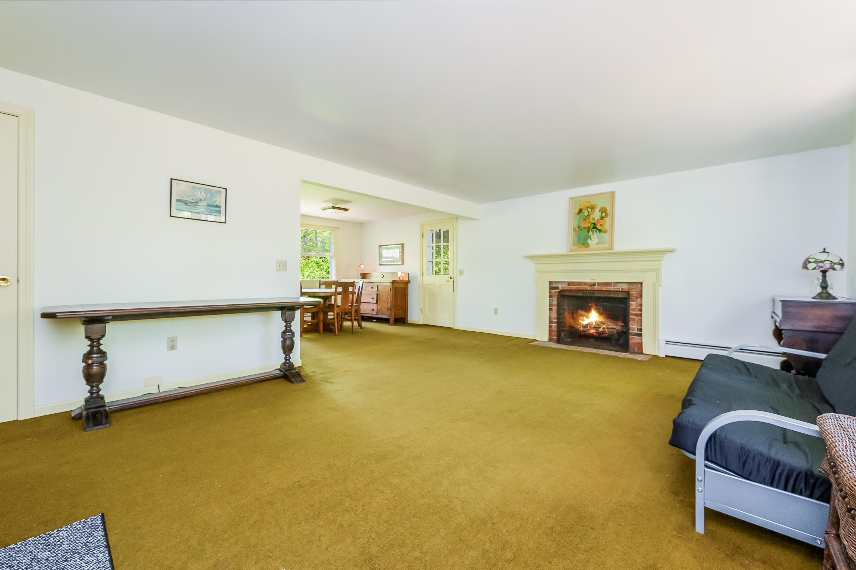 65 Chase Road Falmouth, MA 02540 - Photo 5 of 28 a living room with furniture and a fireplace