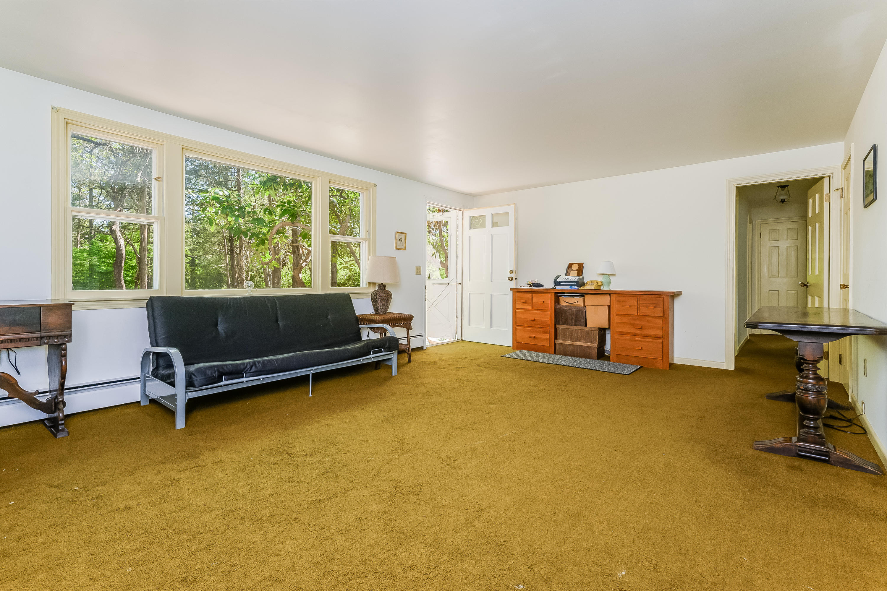 65 Chase Road Falmouth, MA 02540 - Photo 6 of 28 a bedroom with a bed and wooden floor