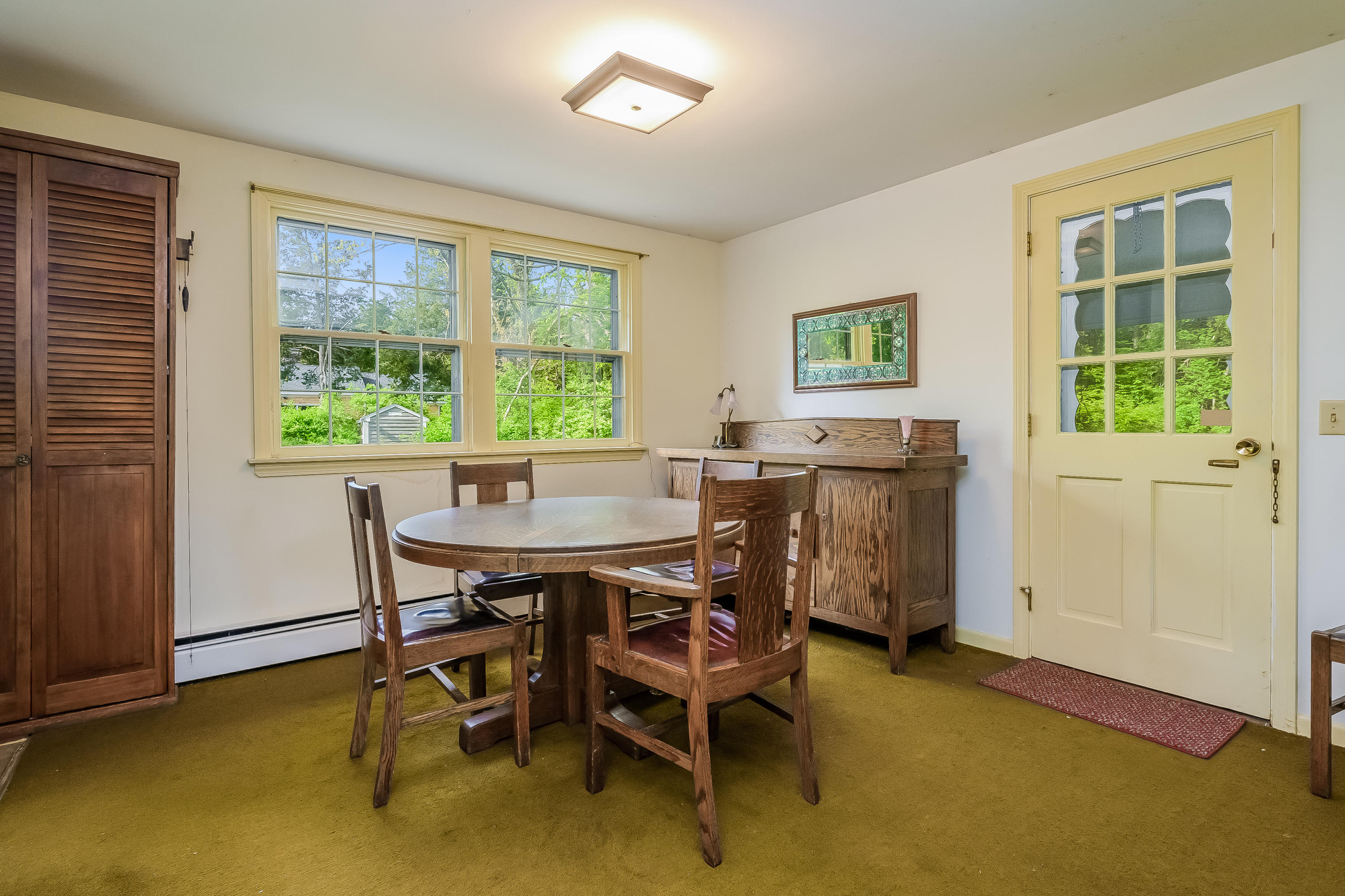 65 Chase Road Falmouth, MA 02540 - Photo 7 of 28 a view of a dining room with furniture and a window