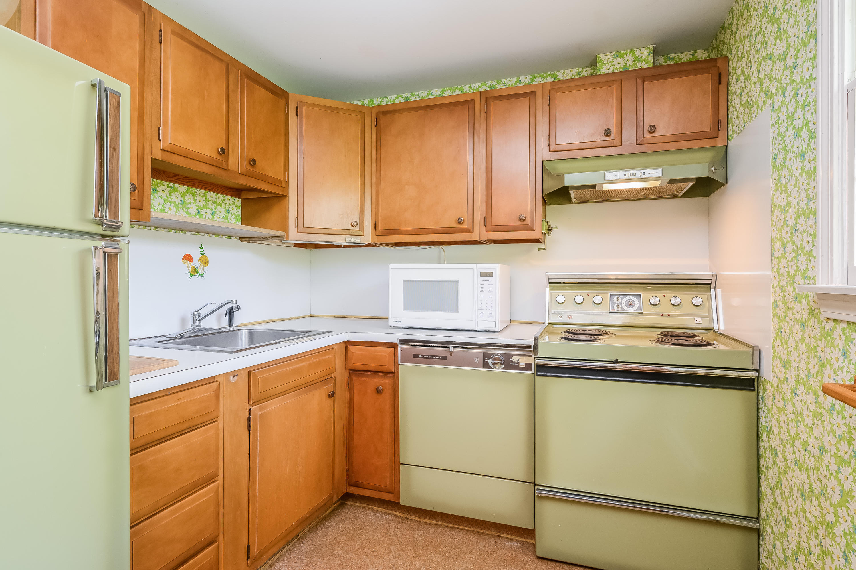 65 Chase Road Falmouth, MA 02540 - Photo 9 of 28 a kitchen with cabinets stainless steel appliances and a sink