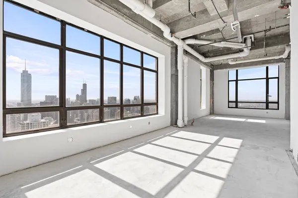 a view of an empty room with a large window
