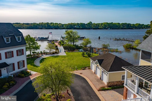 an aerial view of a house with a lake view