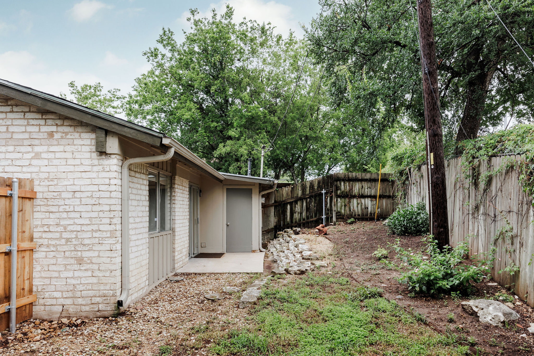 2012 Cody Court Austin, TX 78704 - Photo 40 of 40 A private backyard oasis with mature trees and a sturdy wood fence.