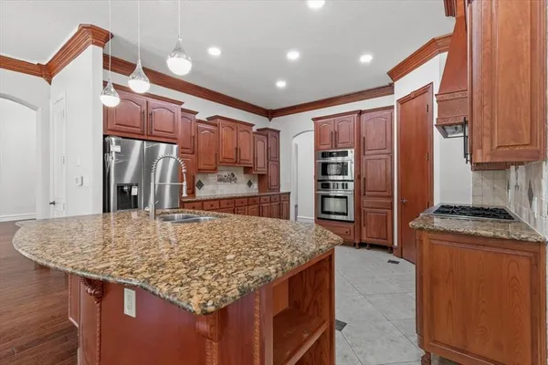a view of kitchen with cabinets and wooden floor