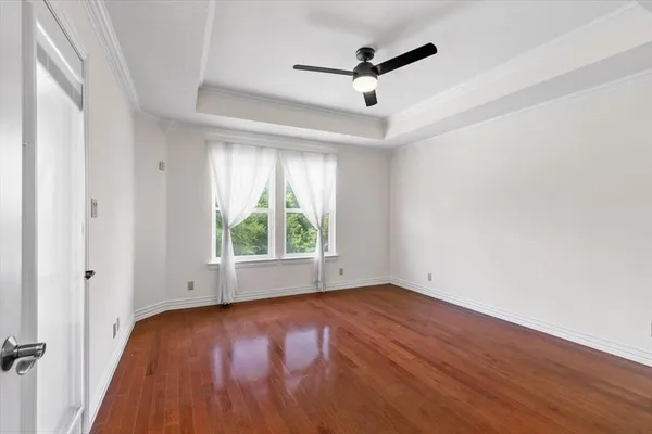 a view of a porch with a floor to ceiling window and a yard