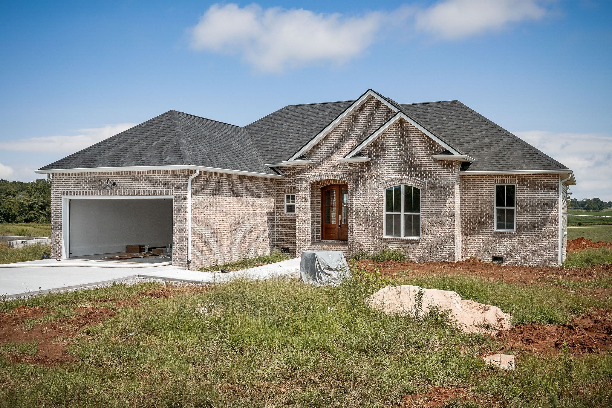 a front view of a house with a yard