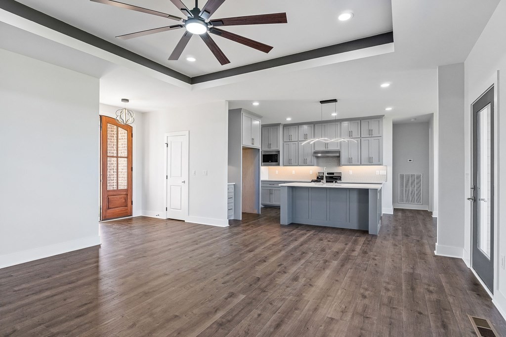 136 Dairy Barn Road Sparta, TN 38583 - Photo 16 of 58 a large kitchen with a lot of counter space and wooden floor