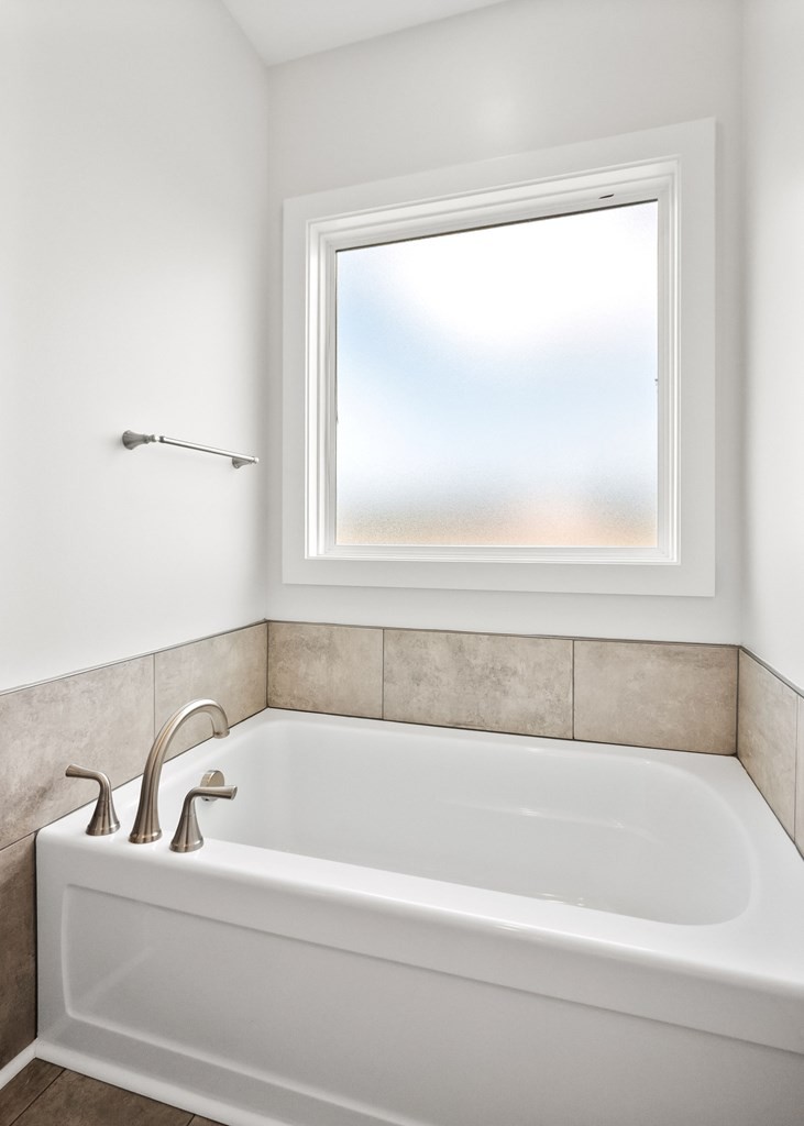 136 Dairy Barn Road Sparta, TN 38583 - Photo 37 of 58 a white bath tub sitting next to a window