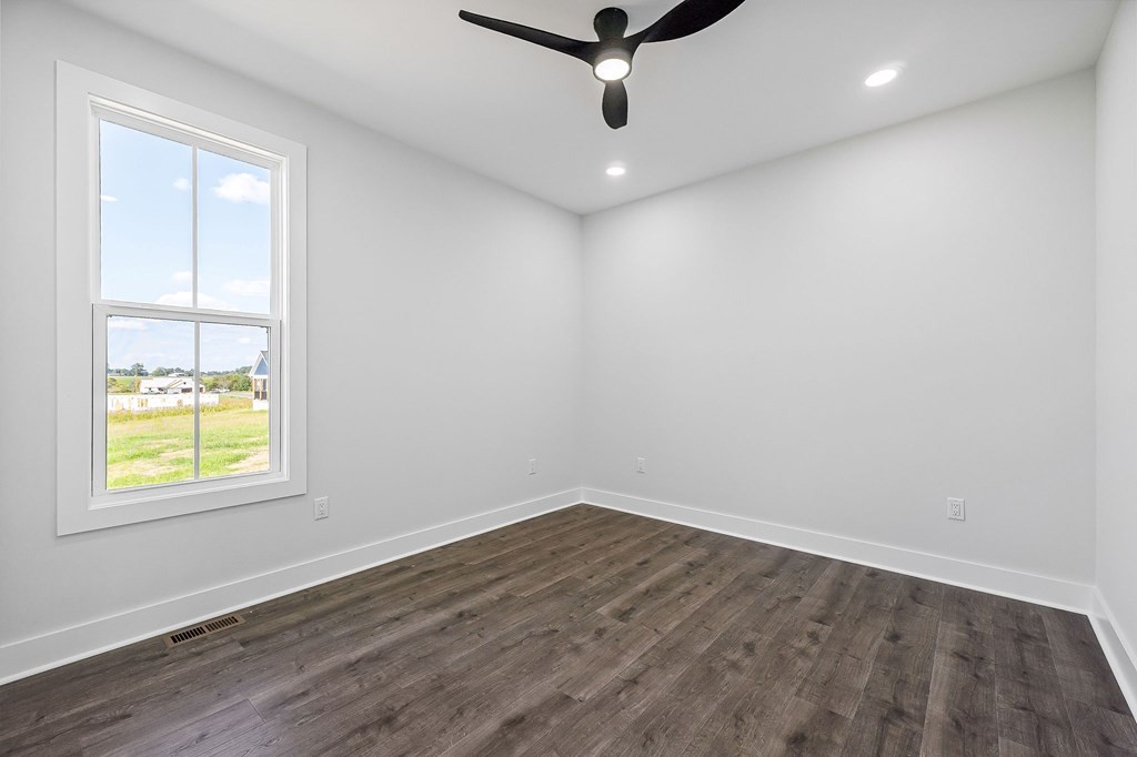 136 Dairy Barn Road Sparta, TN 38583 - Photo 57 of 58 an empty room with a window and a ceiling fan