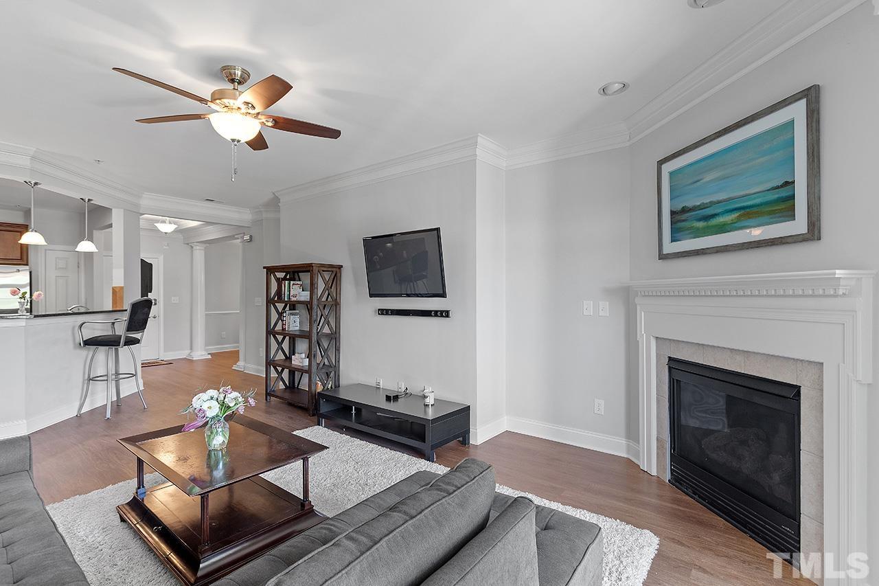 10421 Rosegate Court, Unit 5 Raleigh, NC 27617 - Photo 16 of 35 a living room with furniture and a fireplace