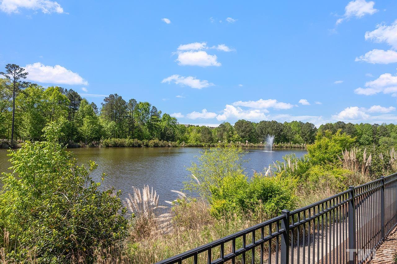 10421 Rosegate Court, Unit 5 Raleigh, NC 27617 - Photo 22 of 35 a view of a lake from a balcony