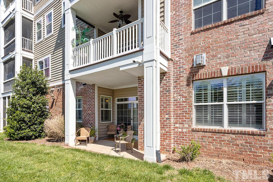 10421 Rosegate Court, Unit 5 Raleigh, NC 27617 - Photo 24 of 35 front view of a brick house with a yard