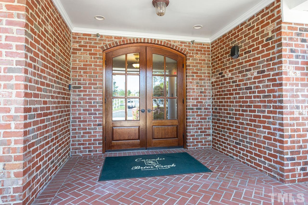 10421 Rosegate Court, Unit 5 Raleigh, NC 27617 - Photo 3 of 35 a view of a brick house with windows