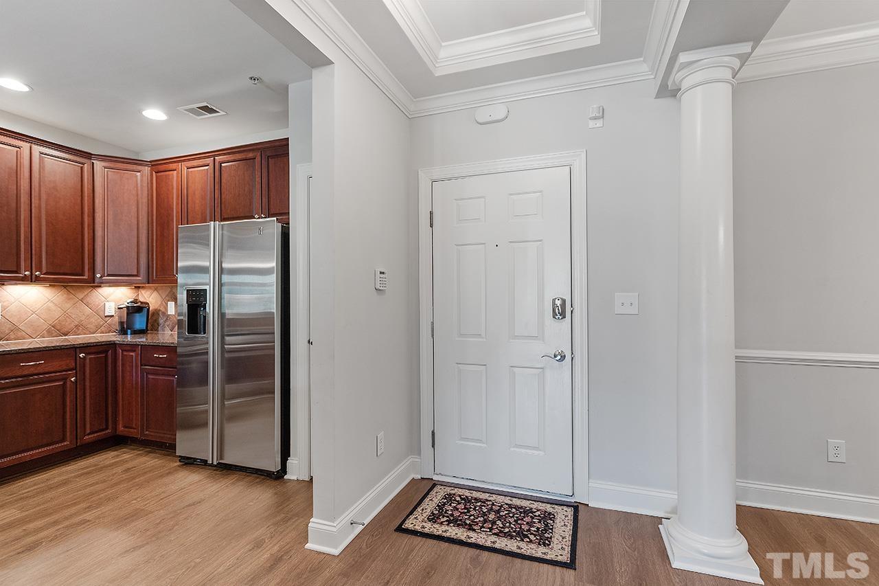 10421 Rosegate Court, Unit 5 Raleigh, NC 27617 - Photo 7 of 35 a kitchen with granite countertop a refrigerator and a stove
