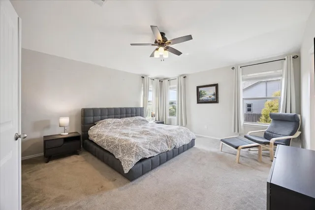 a living room with a bed furniture and a window