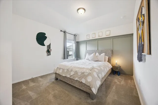 a bedroom with a bed and window