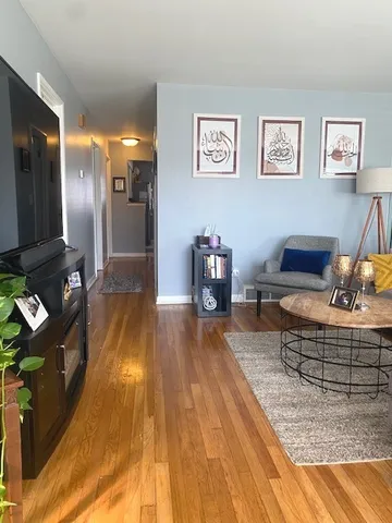 a lobby with furniture and a table