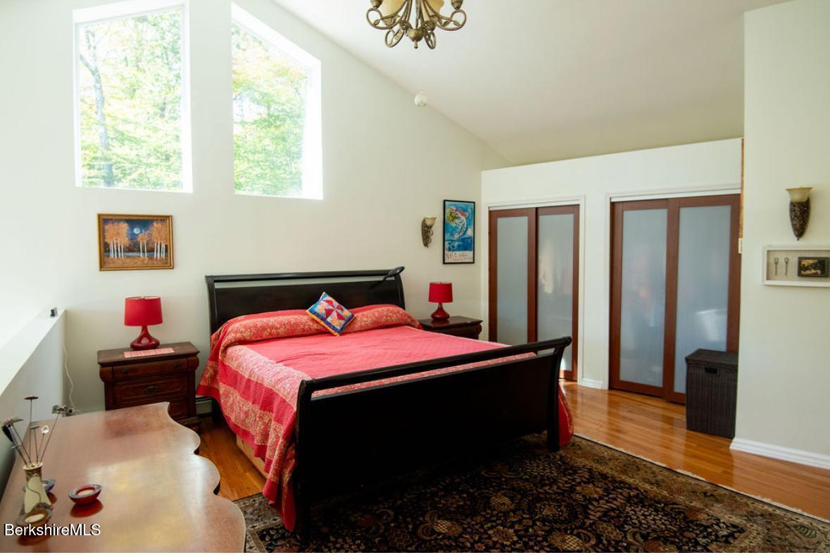 107 Wilderness Way Stephentown, NY 12169 - Photo 12 of 33 a bedroom with a bed and a window