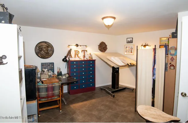 a view of a study room and bathroom