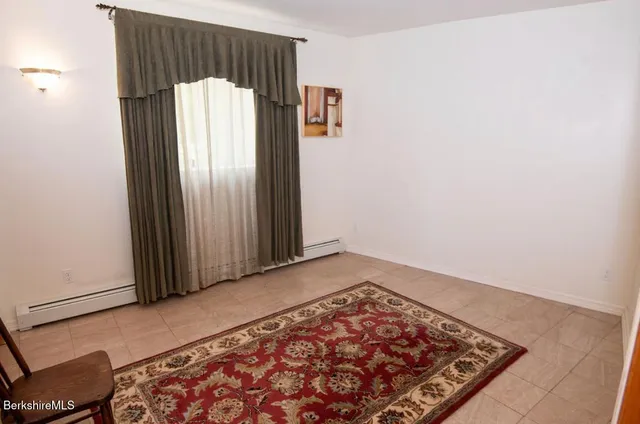 a bathroom with a sink vanity and mirror