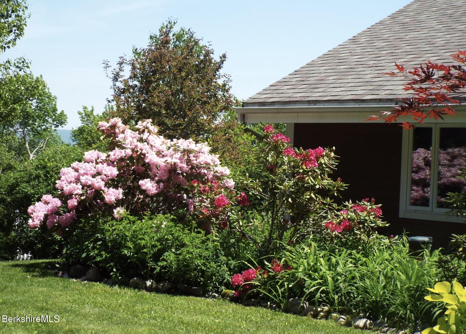 107 Wilderness Way Stephentown, NY 12169 - Photo 24 of 33 a view of a house with a flower garden