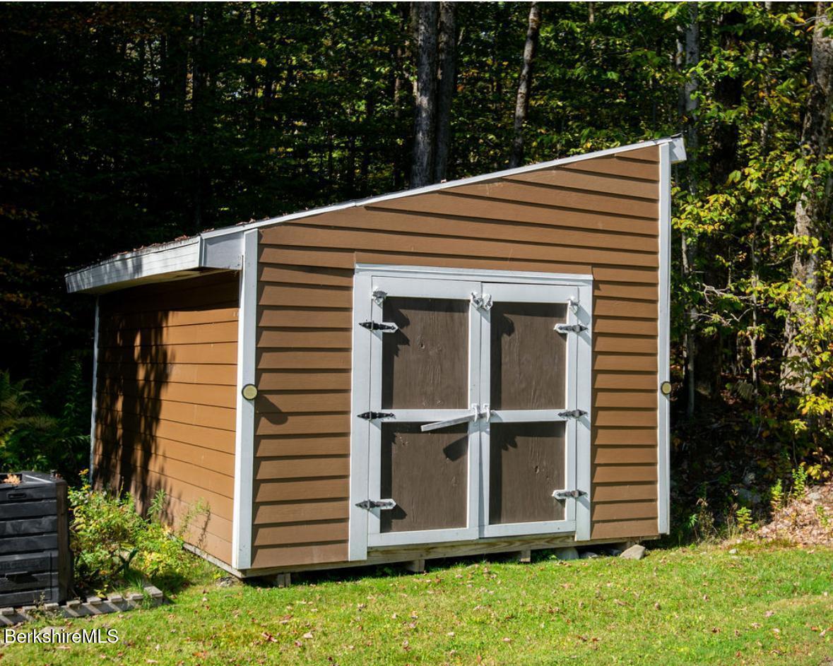 107 Wilderness Way Stephentown, NY 12169 - Photo 29 of 33 a front view of a house with a garden