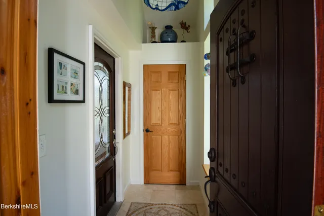 a view of a hallway with elevator and door