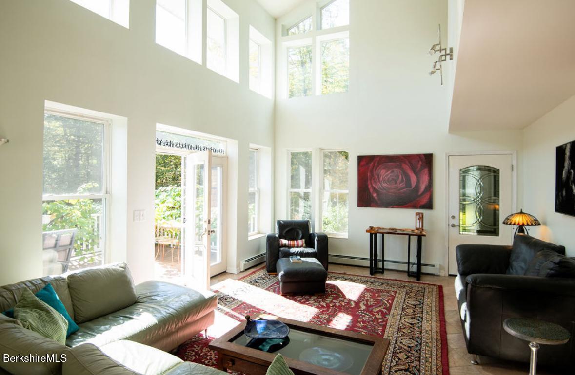 107 Wilderness Way Stephentown, NY 12169 - Photo 6 of 33 a living room with furniture and a flat screen tv