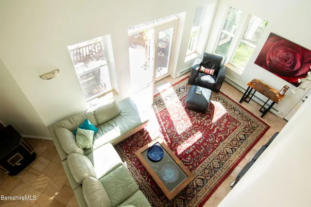 a living room with furniture and a rug