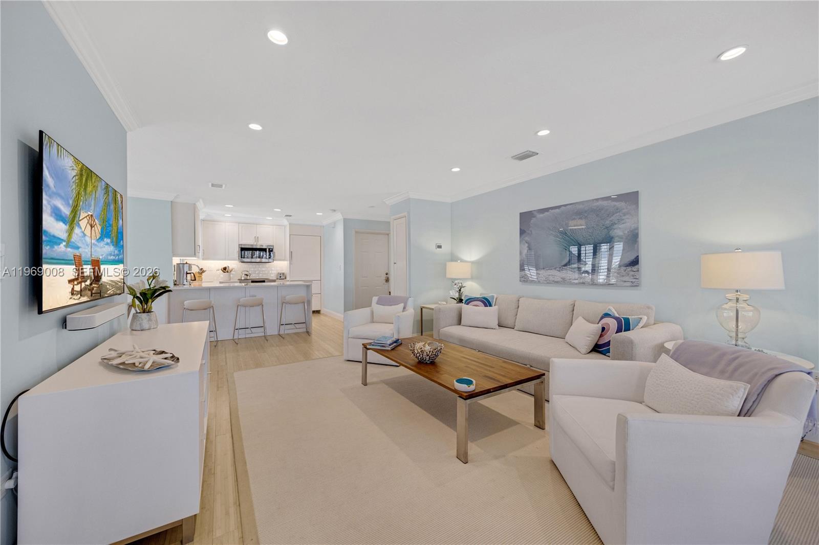 26 Marlin Lane, Unit B Key Largo, FL 33037 - Photo 1 of 16 a living room with furniture and a flat screen tv