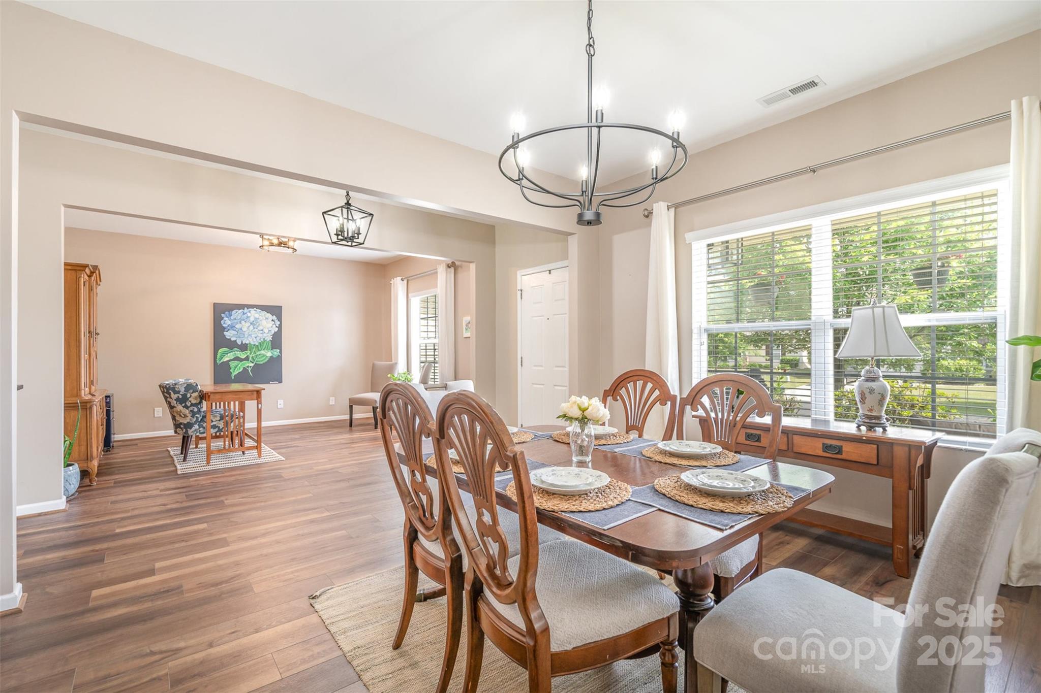 1244 Tranquil Falls Lane Matthews, NC 28104 - Photo 10 of 40 a view of a dining room with furniture window and outside view