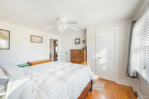 a bedroom with furniture and a window