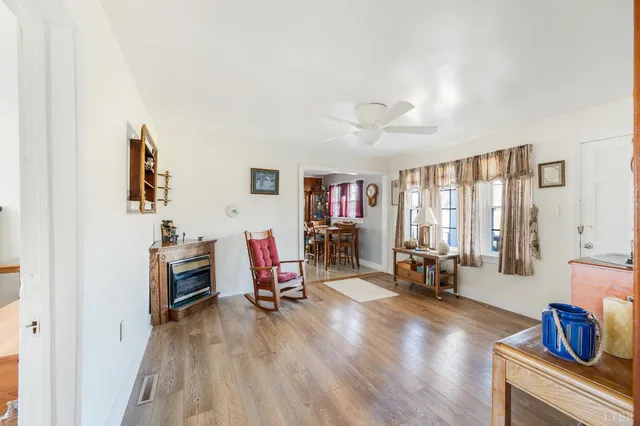 a bathroom with a window a sink and a shower